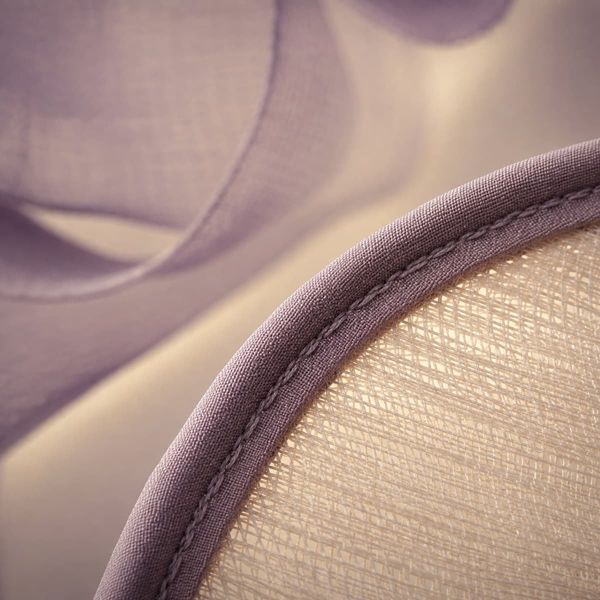 Satin-bound edge of a wide couture brim