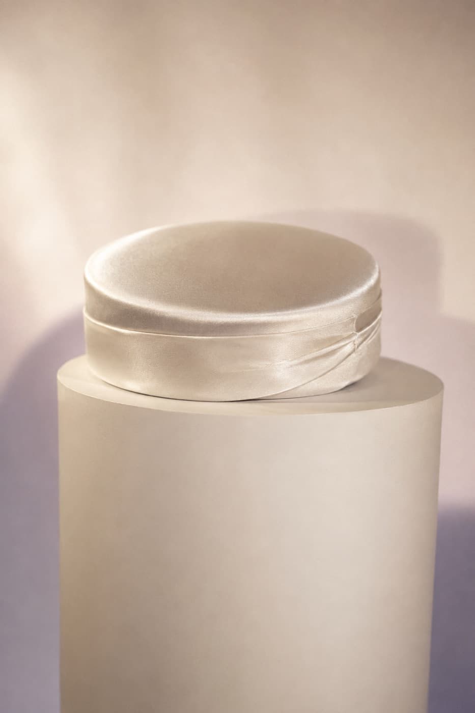 Pillbox Satin photographed whole against an ivory ground